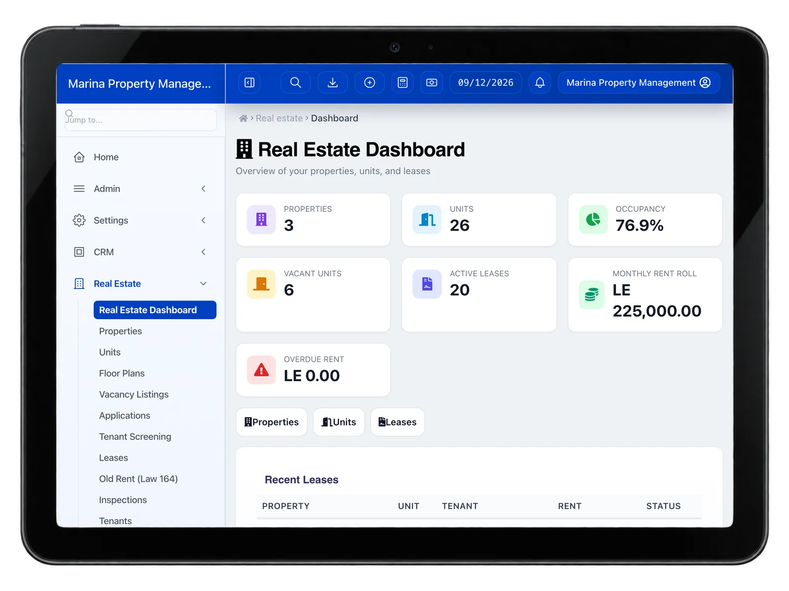 A tablet showing the property management dashboard: properties, units, occupancy, monthly rent roll and overdue rent.